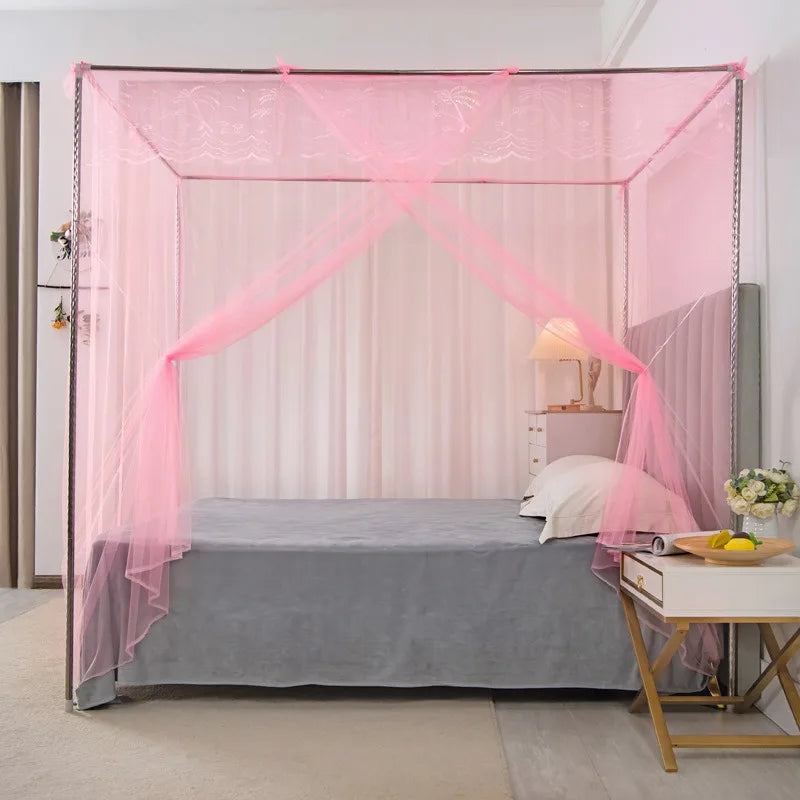 A pink lace canopy mosquito net draped over a bed, creating a romantic enclosure.