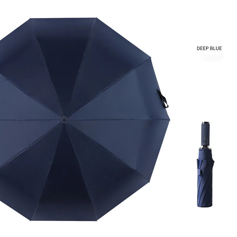 A dark blue automatic foldable umbrella with a closed canopy and the handle visible.