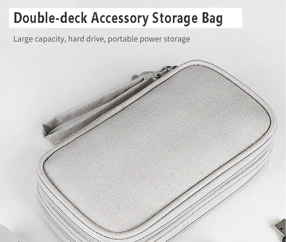 A gray double-deck accessory storage bag with a zipper, designed for large capacity and portable power storage.