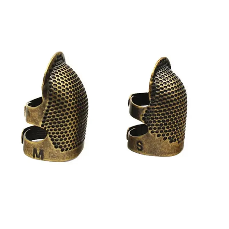 Vintage metal sewing thimble with finger protector ring showing both the M and S sizes.