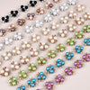 A collection of 20 pearlized resin flower beads in various colors and shades for DIY jewelry making