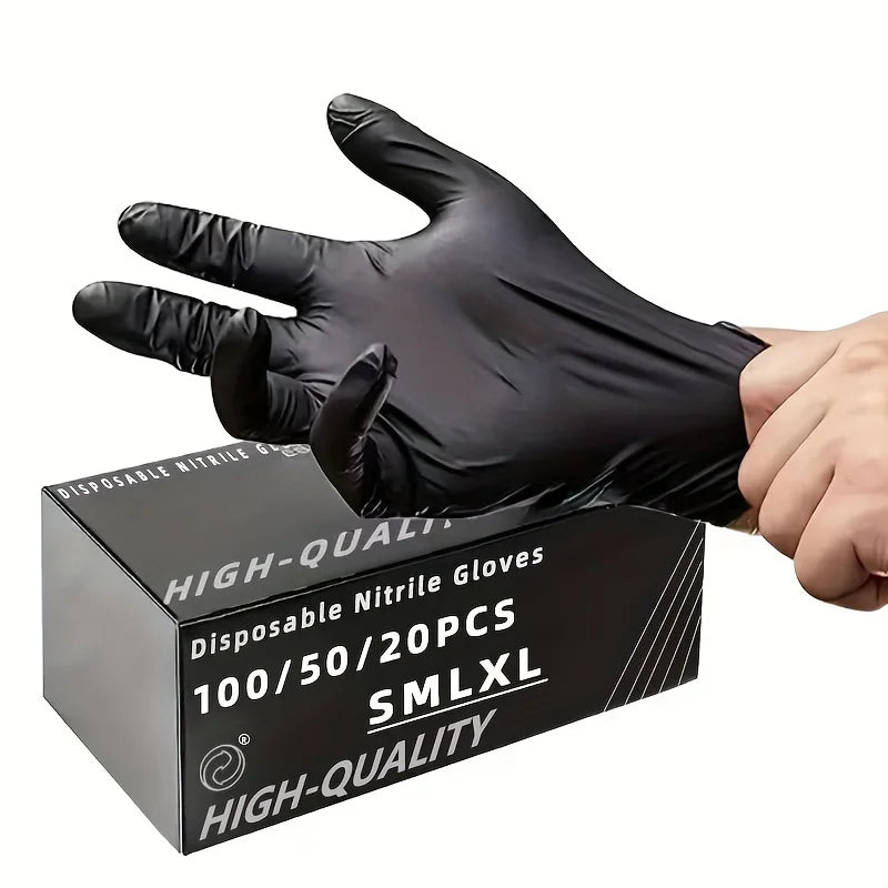 A hand wearing a black disposable nitrile glove is holding a box of high-quality gloves.