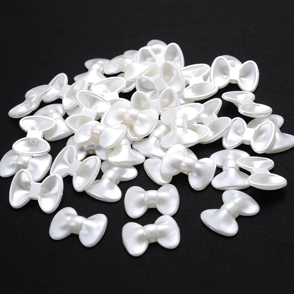A pile of 100 white acrylic pearl spacer beads for jewelry making