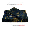 A set of two pillowcases and one duvet cover featuring a dark blue fabric with gold sun and moon patterns.