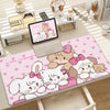 Kawaii cartoon desk mat featuring pink and white fluffy characters with a non-slip rubber base