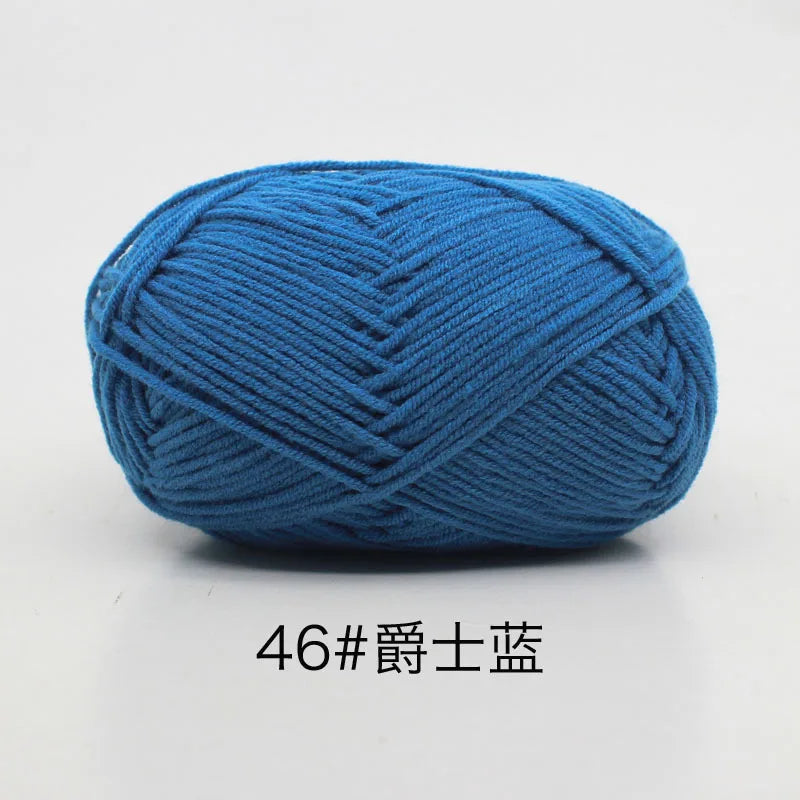 A ball of bright blue 4-ply milk cotton yarn for knitting and crochet.
