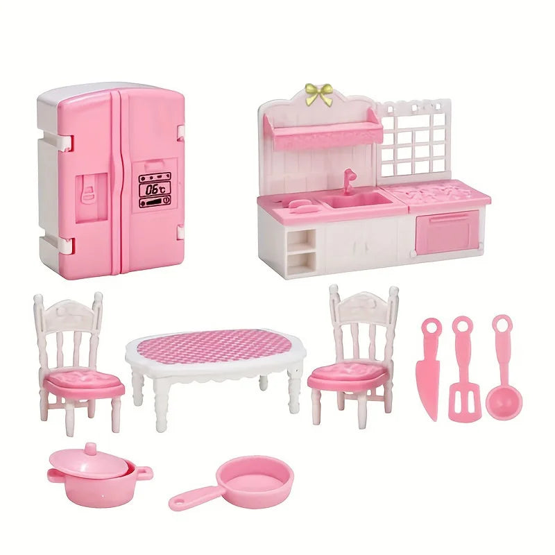 A pink miniature dollhouse furniture set including a refrigerator, kitchen counter, sink, and various utensils.