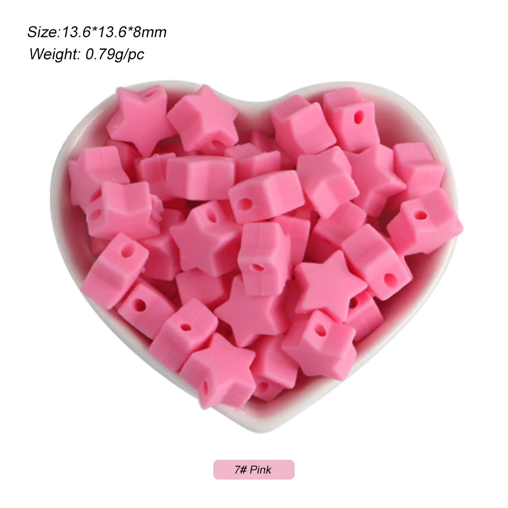 A pile of pink silicone crown star heart beads for DIY jewelry making