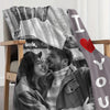 A couple smiling while holding a map, featured on a custom photo flannel blanket.