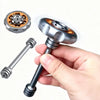 A hand holds a metal fidget spinner with a round top and a long shaft, demonstrating the device.