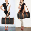 A woman is shown holding a black foldable travel duffel bag with brown accents and a shoe pouch.