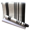 A roll of black and white striped self-adhesive wallpaper.