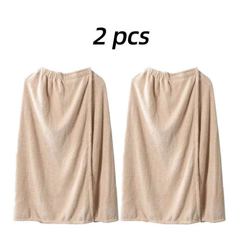 Two beige quick-dry wearable bathrobe towels displayed side by side.