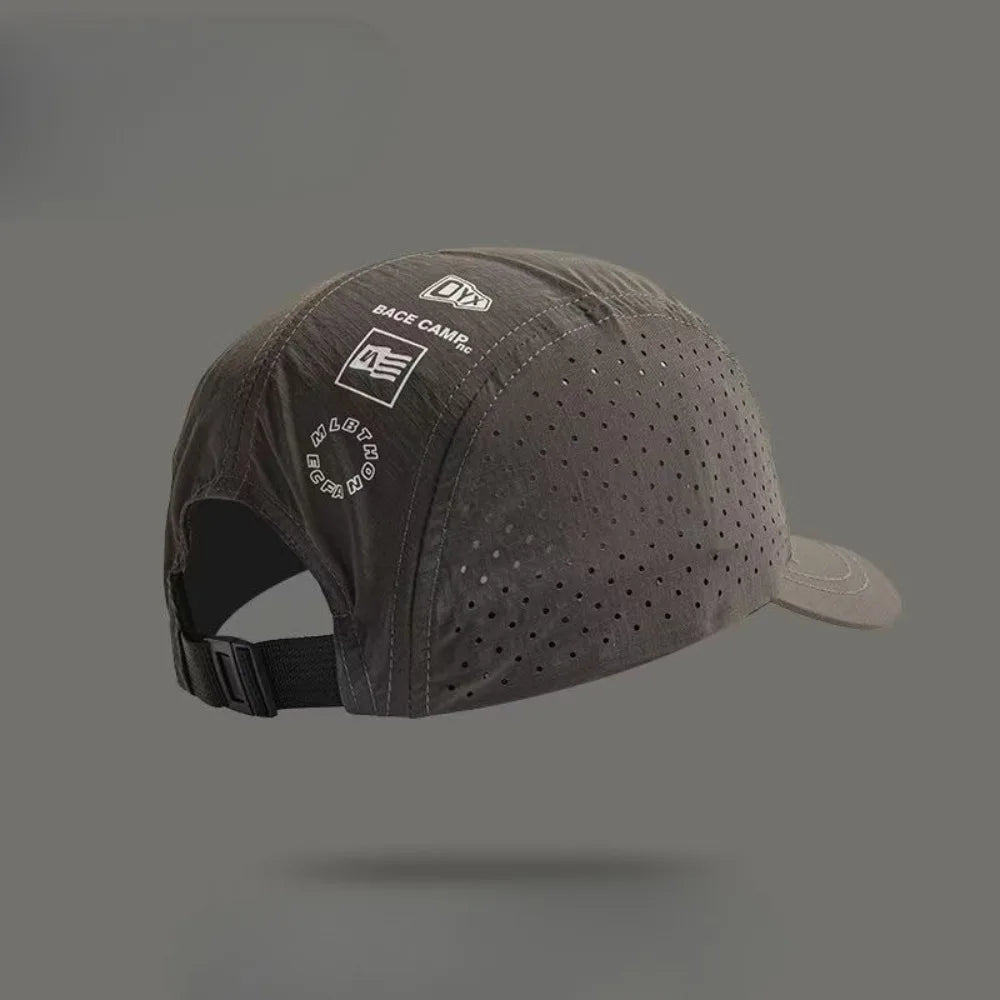 A dark gray mesh baseball cap with a black strap and a white logo on a neutral background.