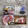 A box set of Metal Fusion Spinning Top Battle featuring a red and purple spinning top and related accessories from Takara Tom