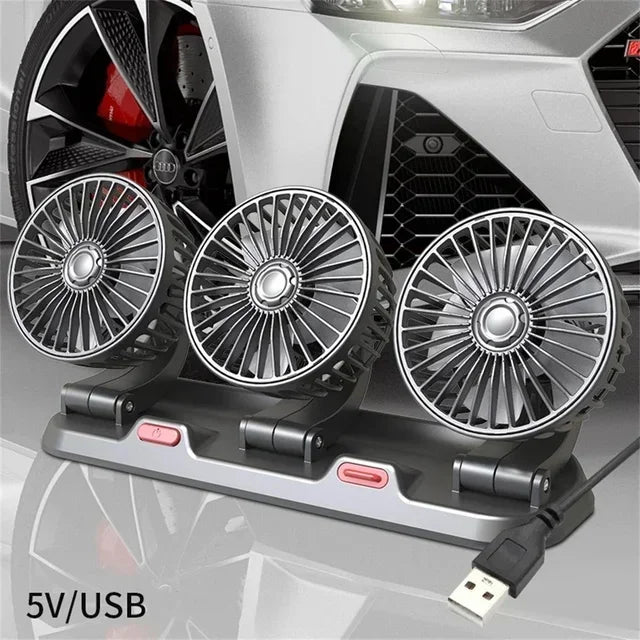 A silver car cooling fan with dual heads and an aromatherapy diffuser mounted on a portable base.