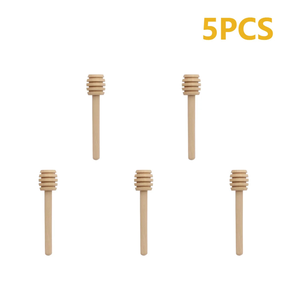 Five natural wood honey dipper sticks displayed individually.