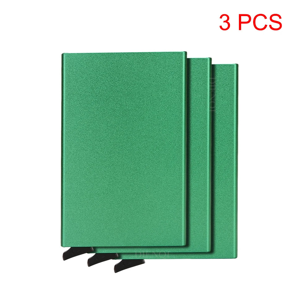 Three green slim metal RFID blocking card holders with a pop-up design