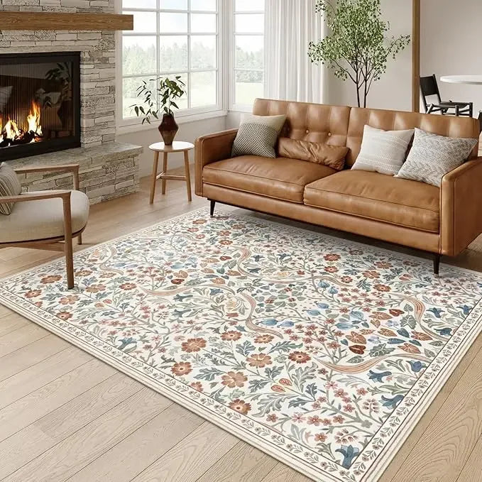 A vintage floral soft area rug with muted colors and botanical patterns placed on a light wood floor.