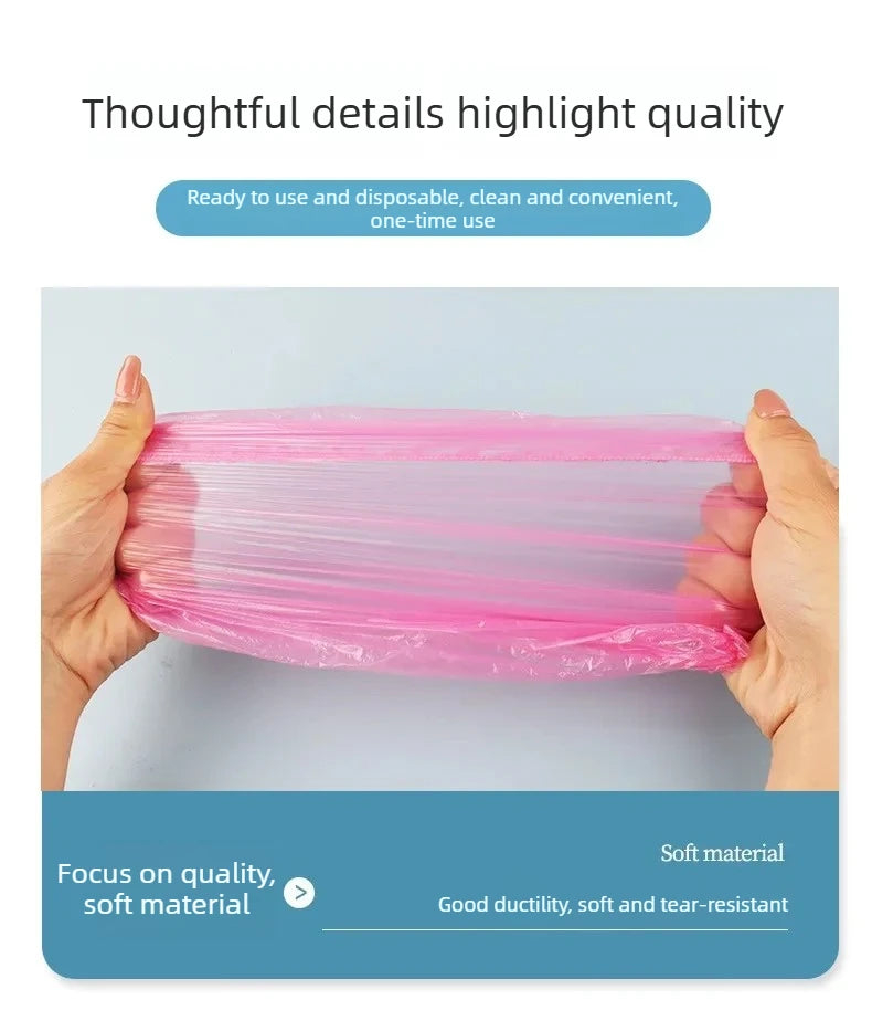 Hands hold a pink disposable waterproof shower cap made of soft, durable material.
