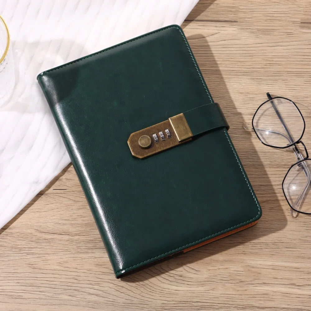 A dark green A5 password-locked diary with a leather strap rests on a light wooden surface.