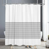 White shower curtain with horizontal black stripes in a modern geometric pattern