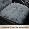 A gray plush seat cushion is shown extended to widen the car seat, demonstrating its function.