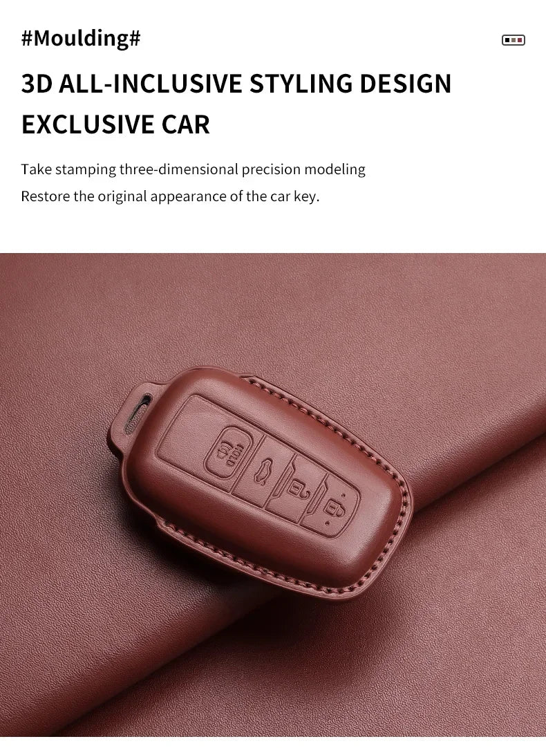 A brown leather key case cover is shown resting on a reddish-brown fabric surface.