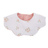 A light pink muslin cotton baby bib with a rounded neckline and small floral embroidery.