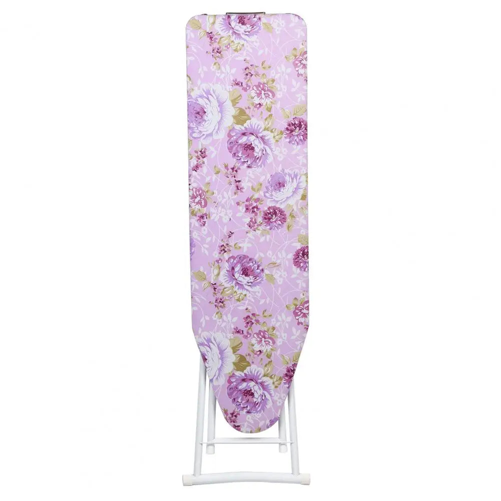 A full-size foldable ironing board with a purple and pink floral pattern on the cover.