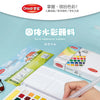 A box set of solid watercolor pigment paints and brushes is shown next to a palette on a light blue background.