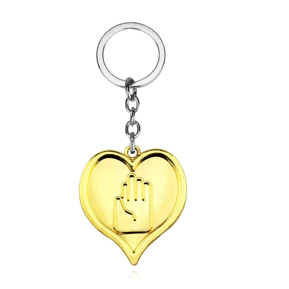 Gold heart pendant necklace featuring a hand sign charm on a silver hoop.