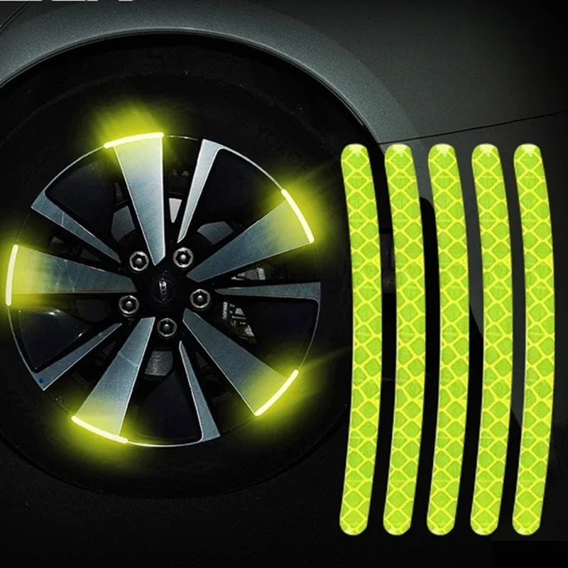 Yellow reflective strips installed on a car wheel rim for enhanced visibility.