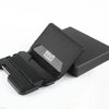 Black minimalist leather card holder with a bottle opener displayed on a white background.