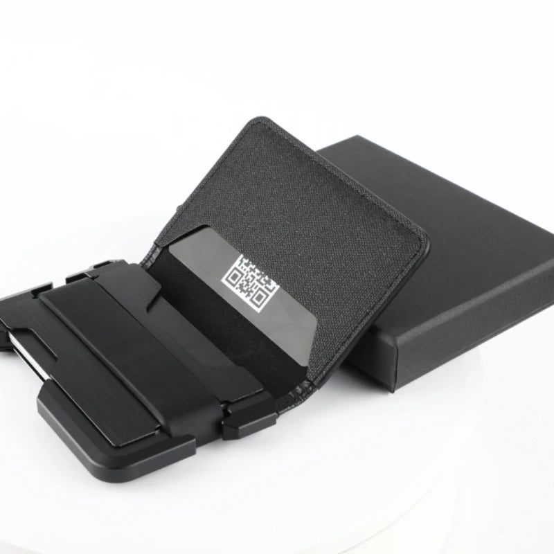 Black minimalist leather card holder with a bottle opener displayed on a white background.