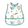 White baby feeding bib with a green trim featuring a lion crown design and decorative leaves