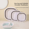 A white foldable portable washbasin shown with multiple units and a small basin in the foreground.