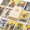 A collection of classic tarot cards and a guidebook displayed in a box.