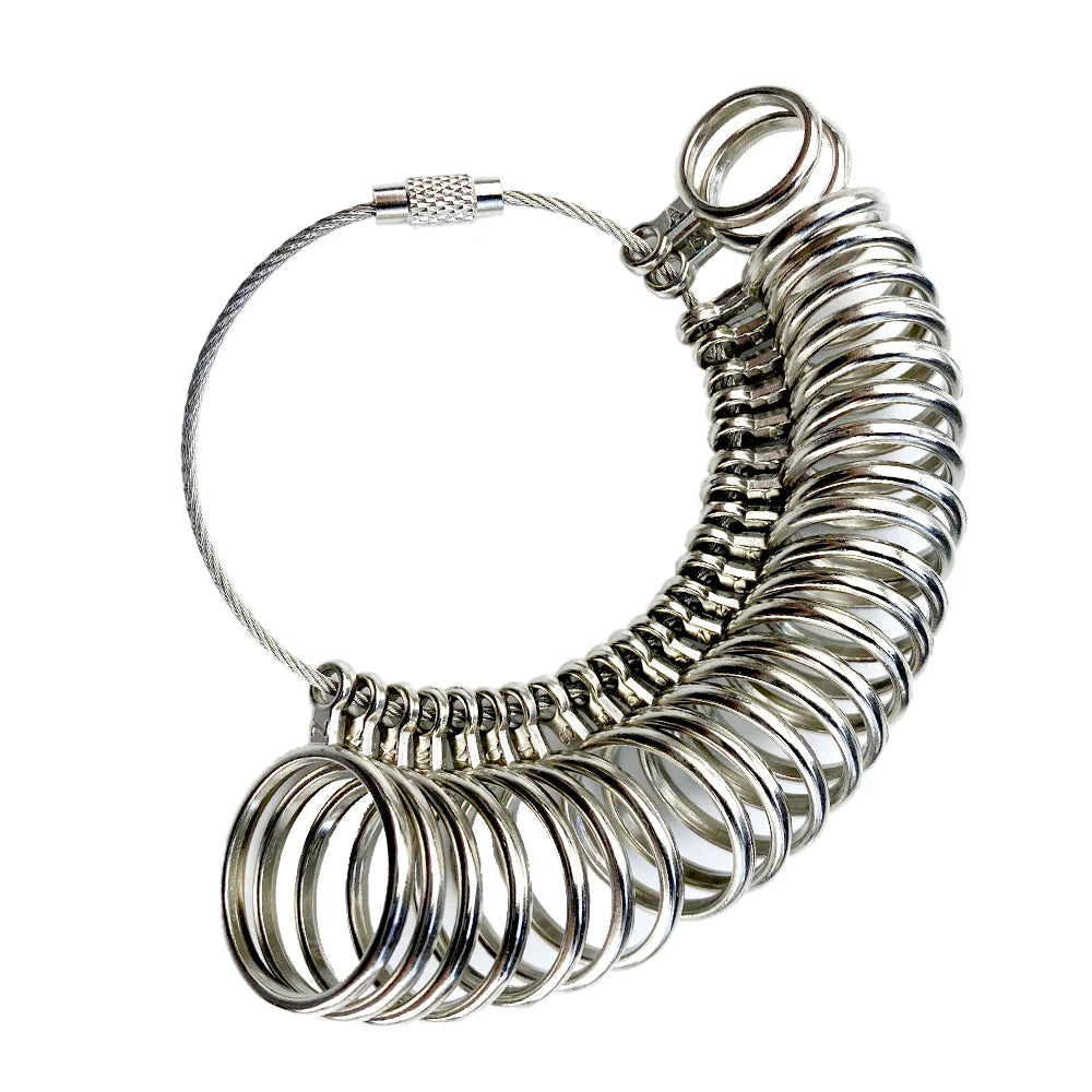 A silver metal ring sizing gauge with multiple conical sizes and a loop for measuring rings.