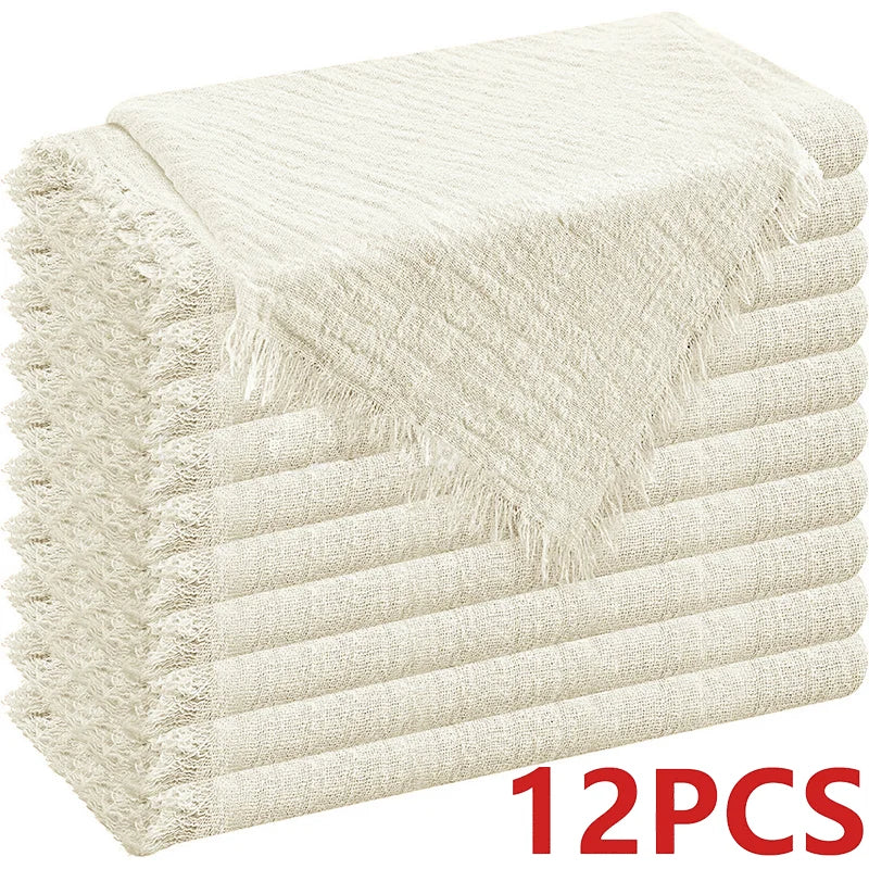 A stack of six raw-edge, light beige polyester cloth napkins.