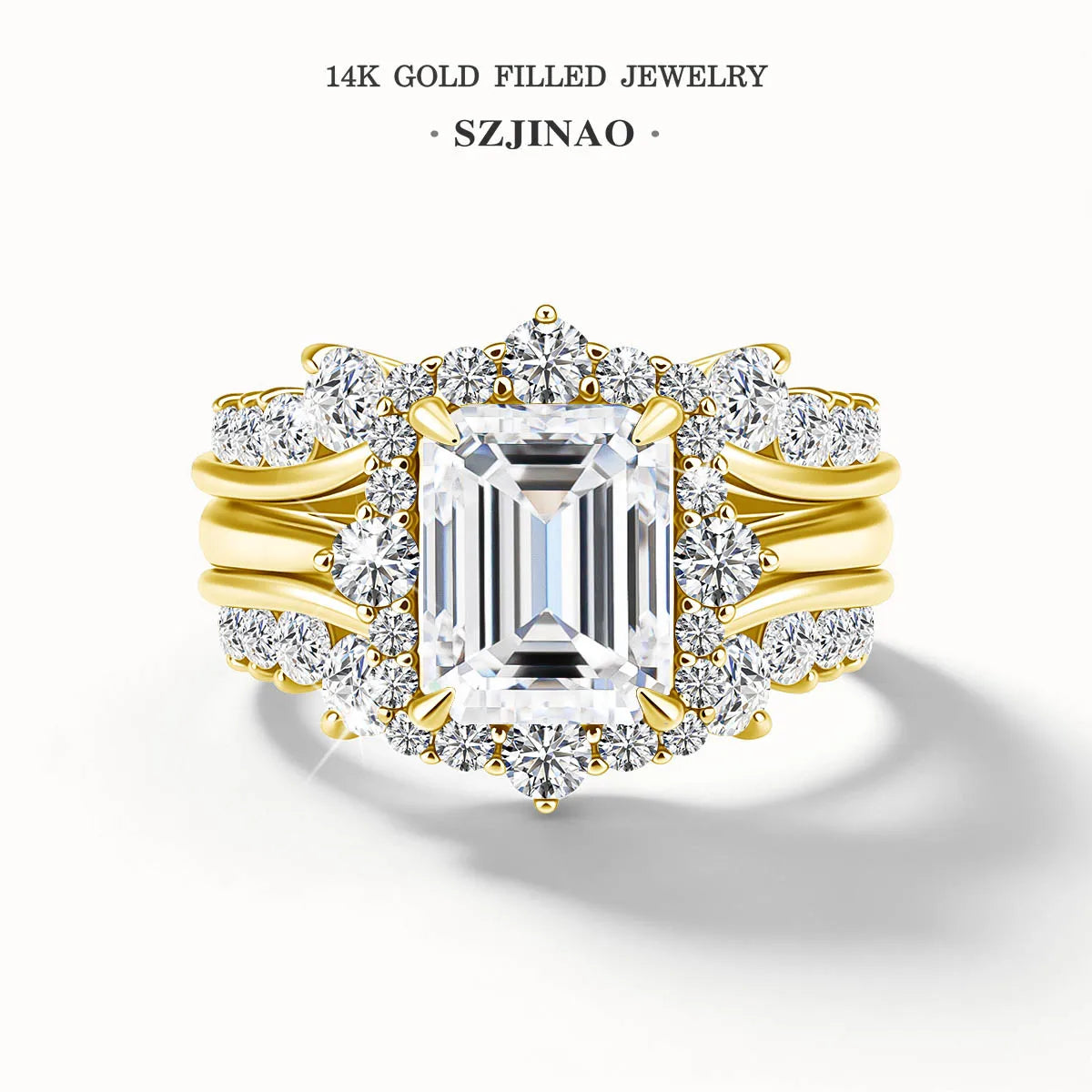 A stackable ring set featuring a 3ct emerald cut moissanite ring in 14K gold filled jewelry.
