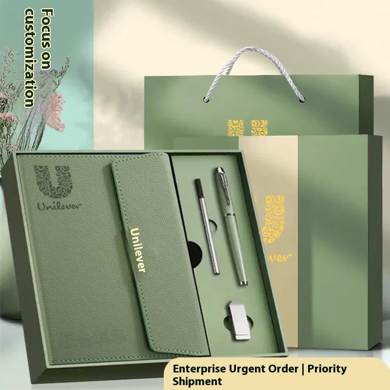 A green leather notebook with a cover and a sleeve is displayed in an open box, emphasizing customization options.