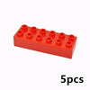 A red building block set consisting of five chunky, interlocking plastic pieces.