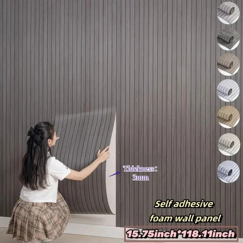 A person is applying an extra thick 3D wood grain self-adhesive foam wall panel to a gray wall.