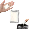 A hand holds a white absorbent powder packet, with another hand placing a similar packet into a black plastic container.
