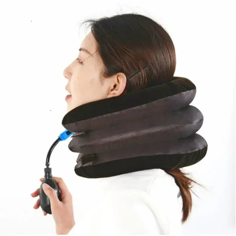 A person is using an inflatable cervical traction neck stretcher for pain relief and relaxation.