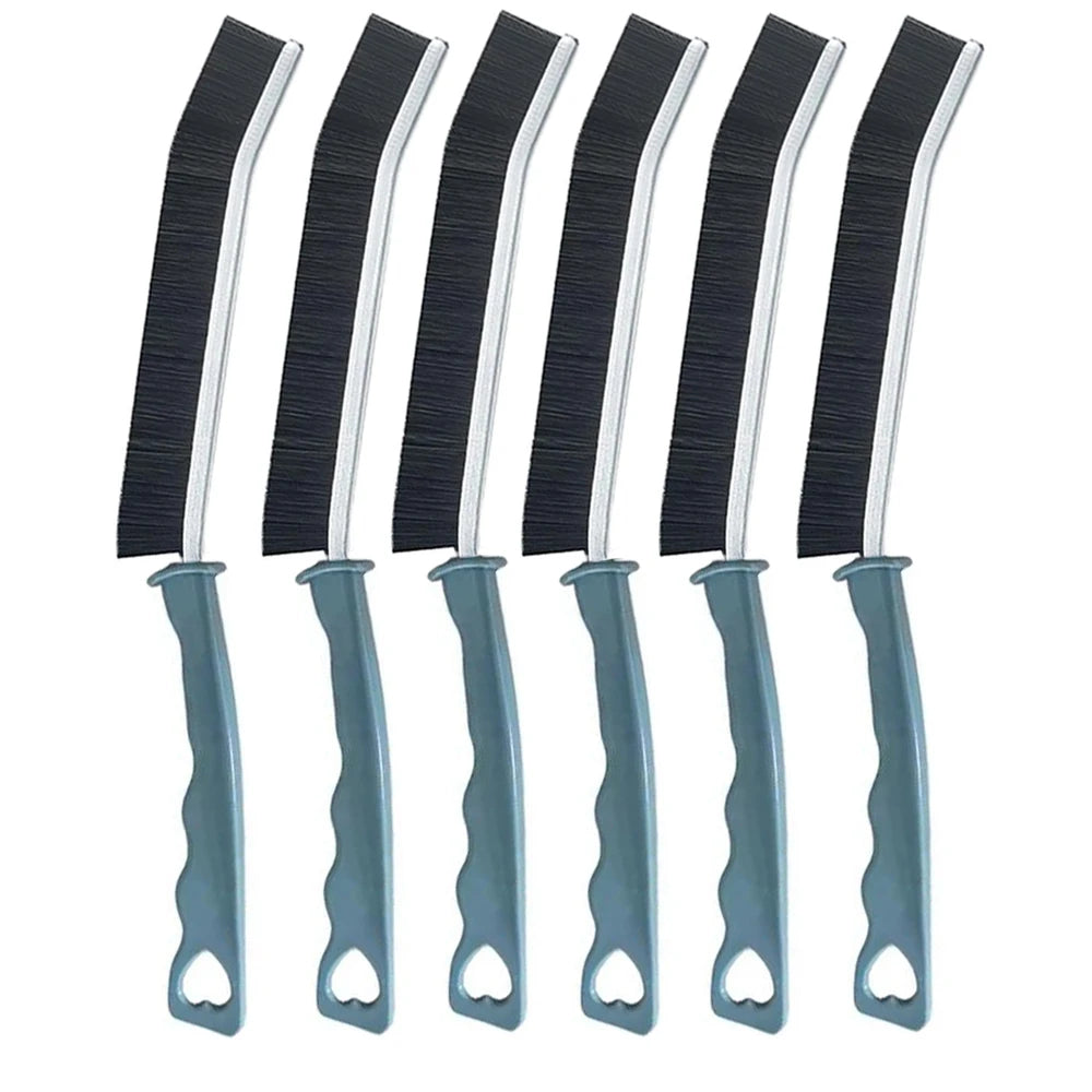 A set of black and silver crevice cleaning brushes for tight spaces