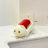 A white cat-shaped soap box with a red drainage tray, shown on a marble surface.