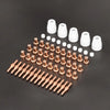 A collection of white and copper plasma cutter torch consumables, including nozzles and tips.