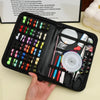 A black portable sewing kit is shown open, displaying various threads, needles, scissors, and other sewing tools.